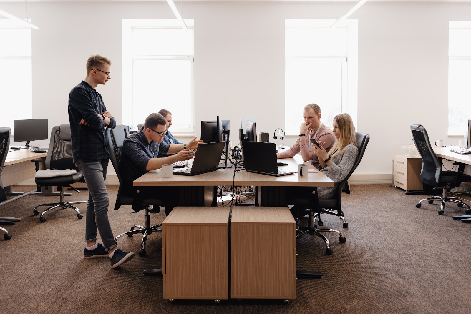 a group of workers in the office