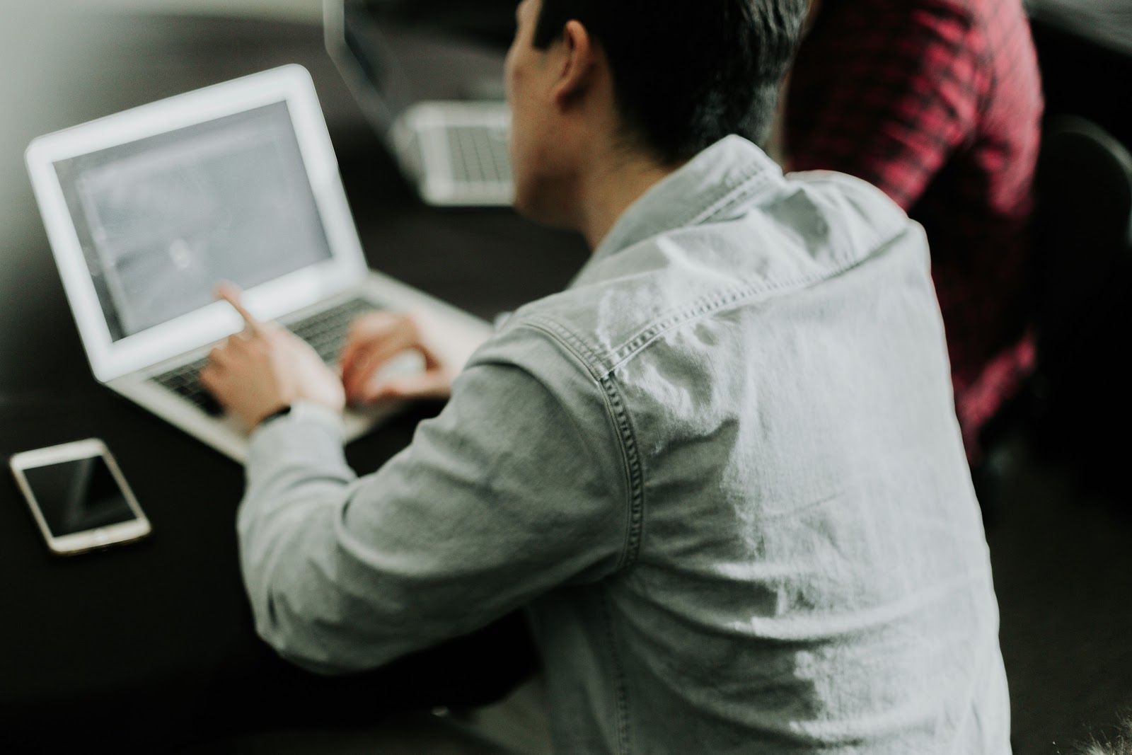 man using a laptop for work